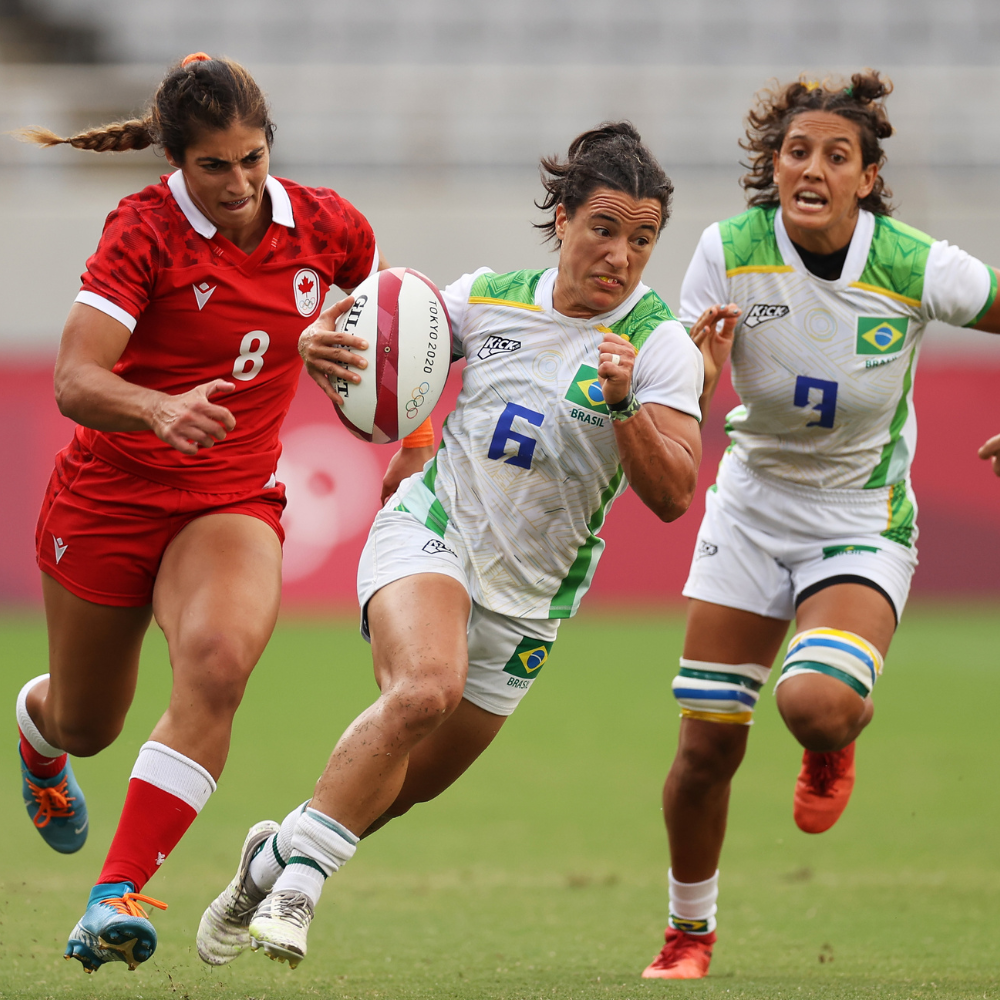 Izzy running with a rugby ball at the Tokyo 2020 Games